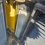 New Holland L185 Radiator Overflow Bottle - Used P/n 87020980. Price: $109.99.