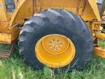 John Deere 410B Left/driver Tire And Rim - Used P/n AT320204. Price: $939.99.